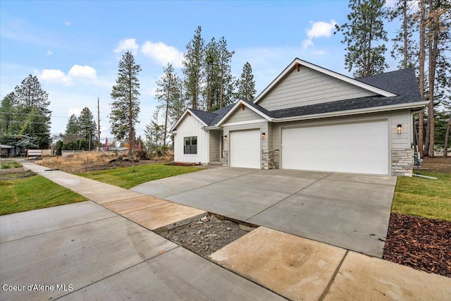 view of front of house with a garage and a front yard