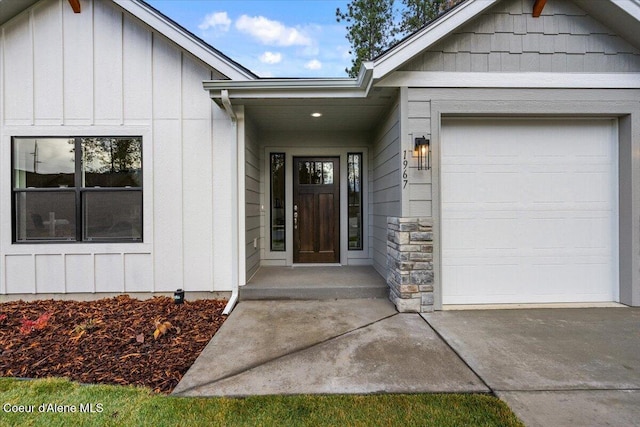 doorway to property featuring a garage