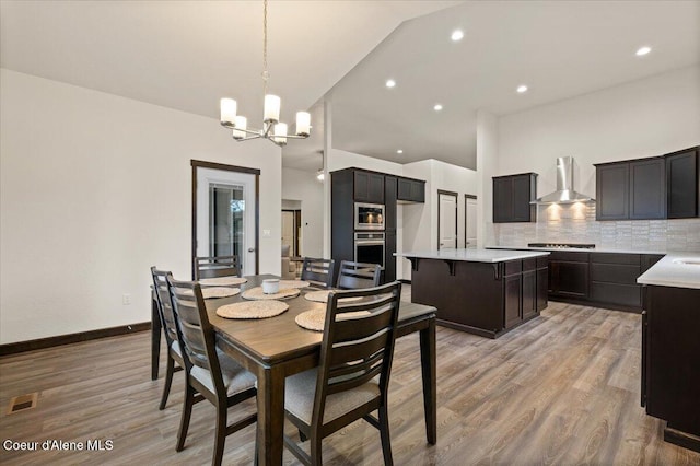 dining space featuring a chandelier and light hardwood / wood-style floors