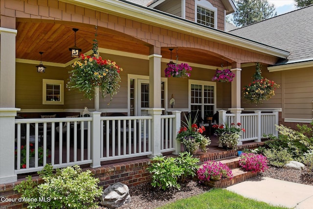 view of exterior entry with covered porch