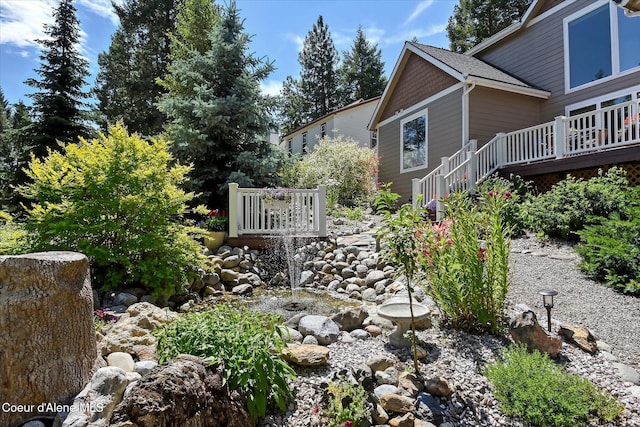 view of yard with a wooden deck