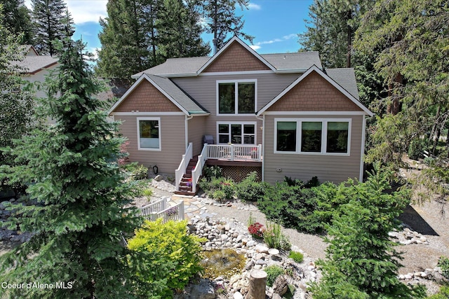 rear view of property with a wooden deck