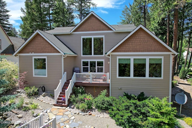 back of house with a wooden deck