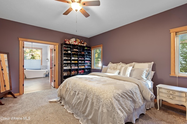 bedroom featuring light colored carpet and ceiling fan