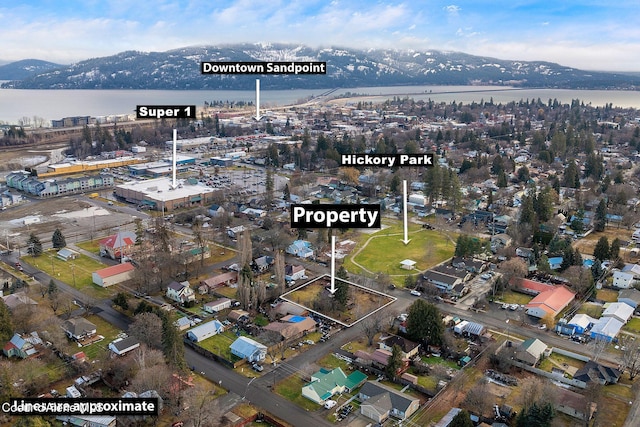 aerial view featuring a water and mountain view