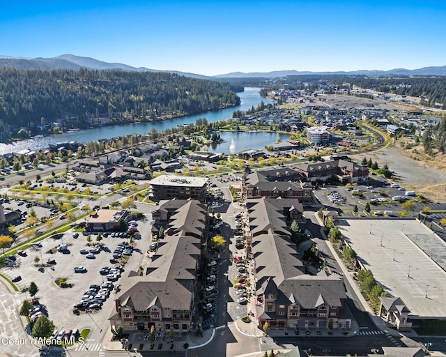 bird's eye view with a water and mountain view