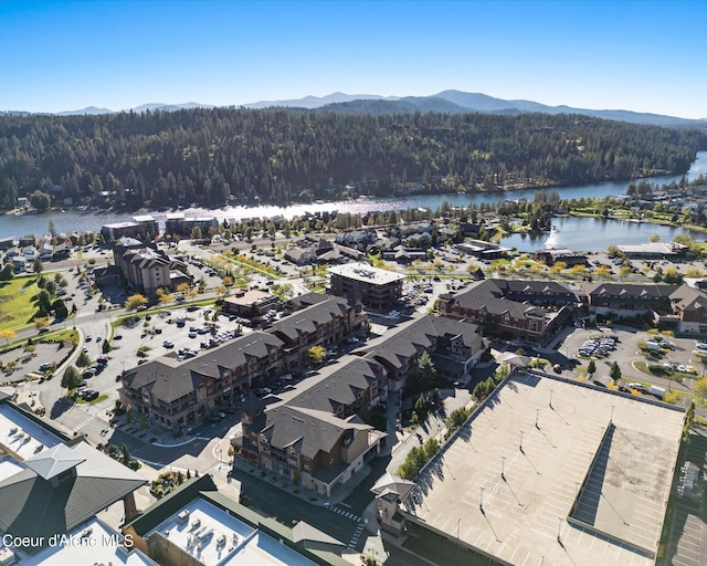 bird's eye view with a water and mountain view