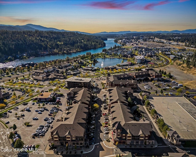 aerial view at dusk with a water and mountain view