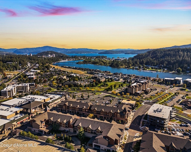 aerial view at dusk with a water and mountain view