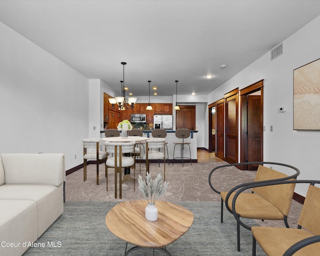 living room featuring a notable chandelier