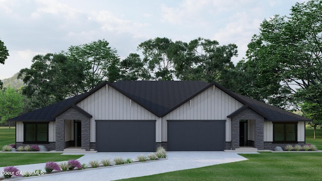 view of front of property with a garage and a front lawn