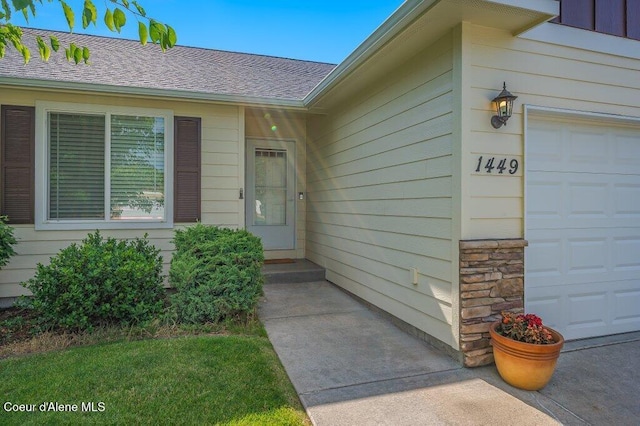 1449 N Moonstone St, Post Falls, ID 83854 - entrance to property with a garage and a shingled roof