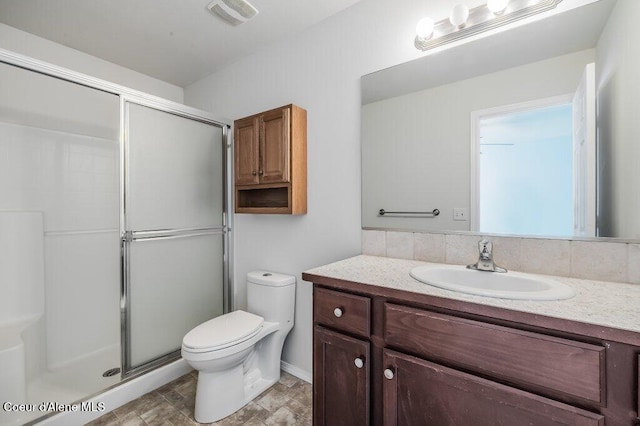 1449 N Moonstone St, Post Falls, ID 83854 - bathroom with vanity, a shower stall, and stone finish flooring