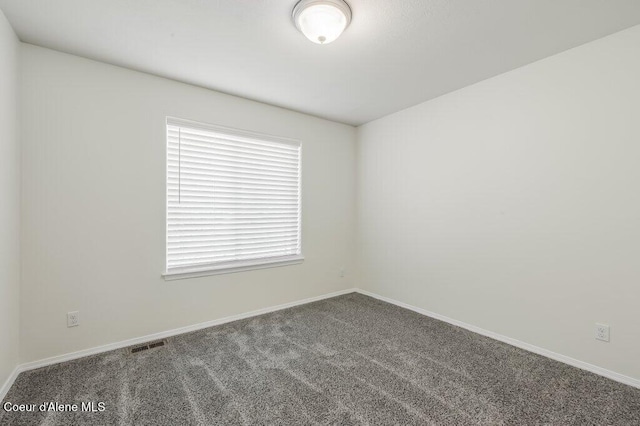 1449 N Moonstone St, Post Falls, ID 83854 - carpeted spare room featuring baseboards