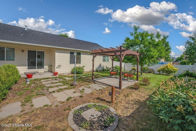 1449 N Moonstone St, Post Falls, ID 83854 - fenced yard featuring a pergola and a patio area