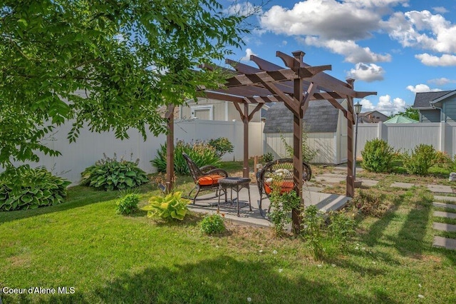 1449 N Moonstone St, Post Falls, ID 83854 - fenced backyard featuring a pergola, a patio, and an outdoor structure