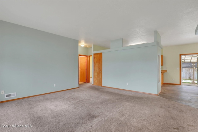 empty room featuring light colored carpet