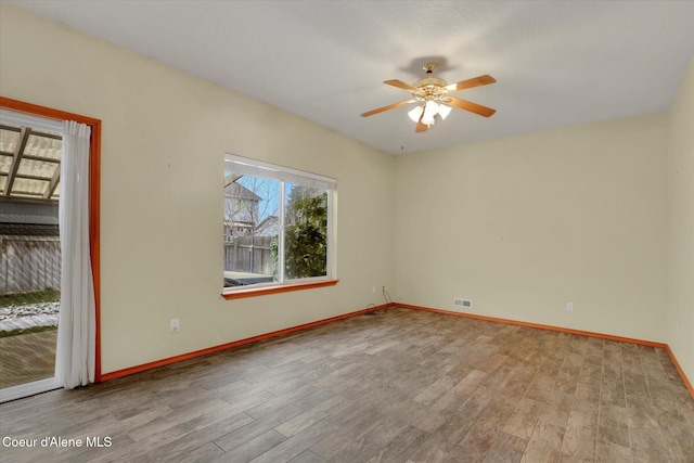 unfurnished room featuring ceiling fan and light wood-type flooring