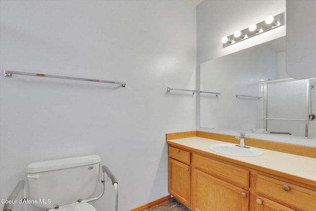 bathroom featuring toilet and vanity