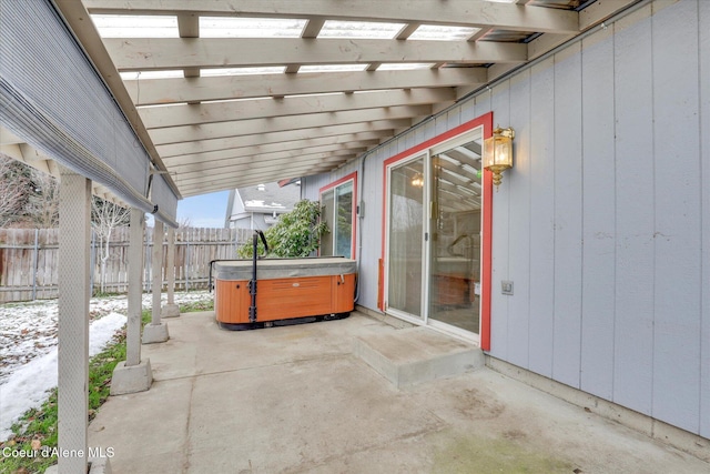 view of patio featuring a hot tub and a pergola