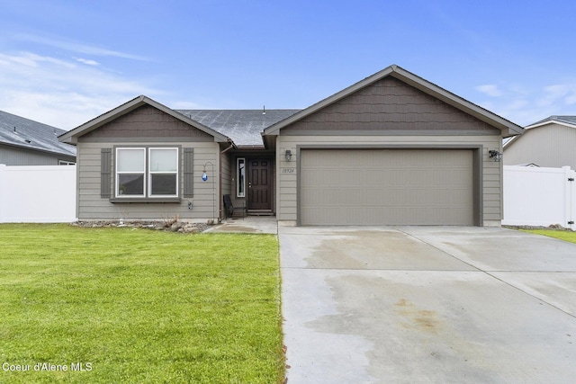 single story home featuring a garage and a front lawn