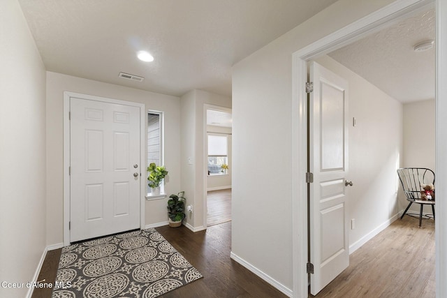 entrance foyer with hardwood / wood-style floors