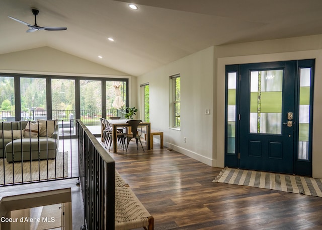 entryway with ceiling fan, dark wood-type flooring, and lofted ceiling