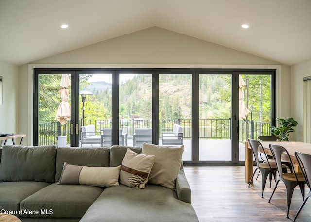 living room with plenty of natural light and light hardwood / wood-style floors