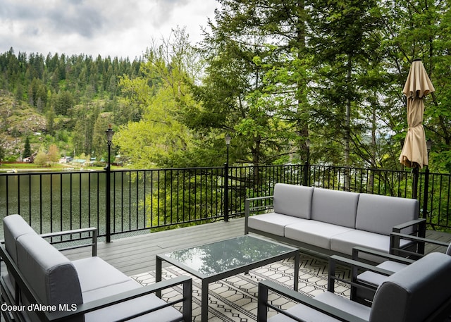 wooden deck with an outdoor living space