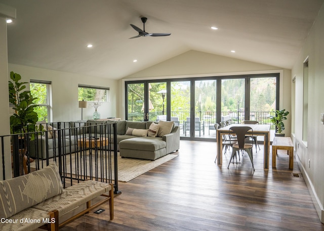 living room featuring ceiling fan, lofted ceiling, and dark wood-type flooring