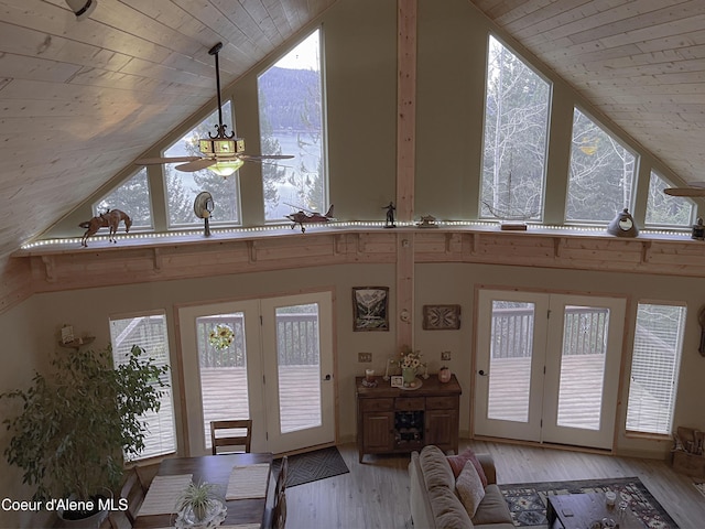 entryway with ceiling fan, high vaulted ceiling, and wooden ceiling