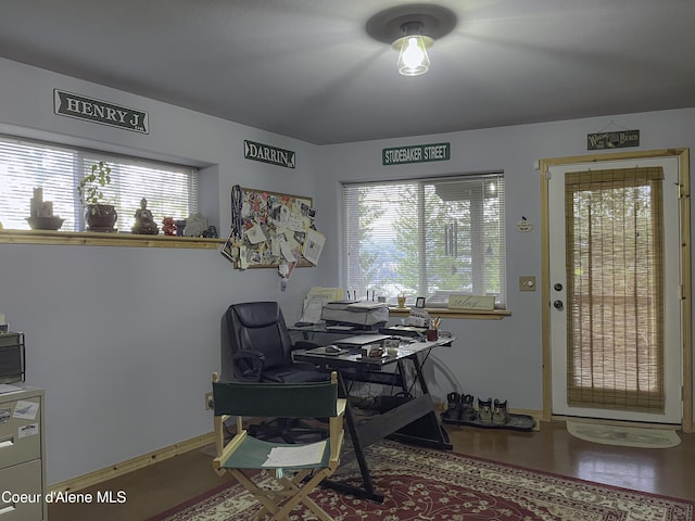 office space with wood-type flooring