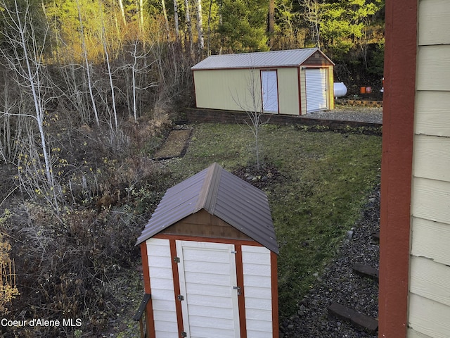 view of outbuilding with a yard