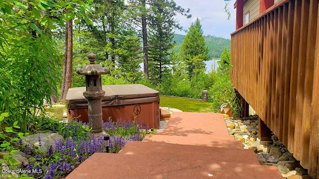 exterior space featuring a patio and a hot tub