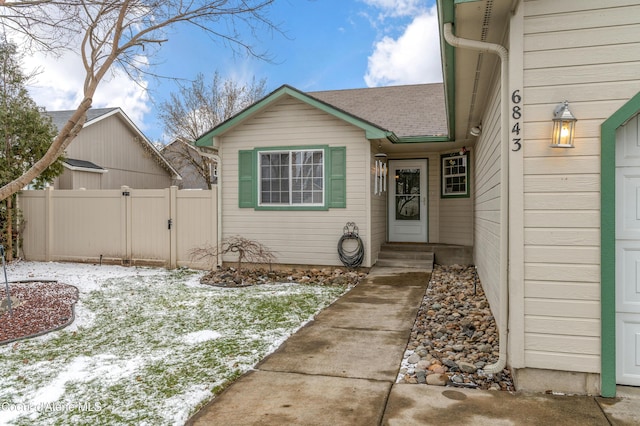 view of snow covered property entrance