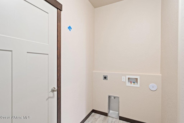 clothes washing area with hookup for a washing machine, light wood-type flooring, and electric dryer hookup