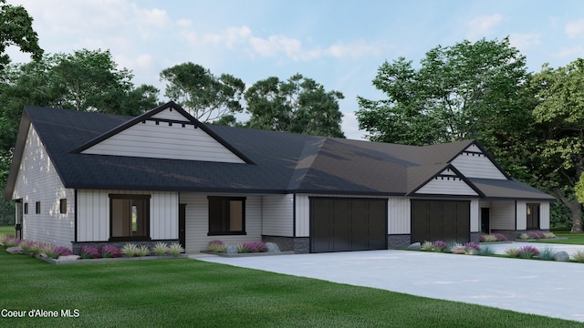 view of front facade with a front yard and a garage