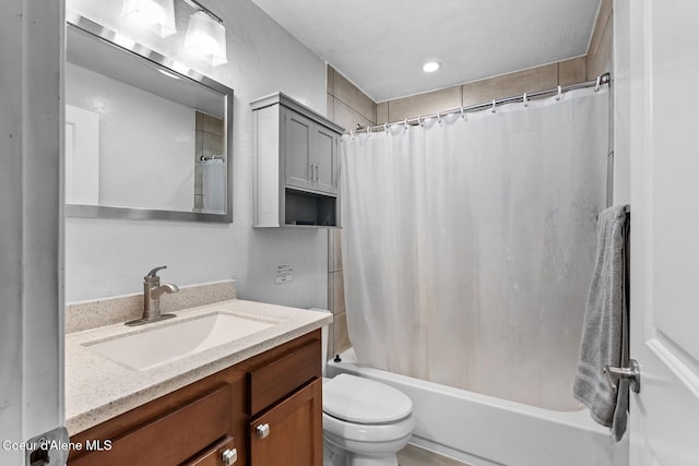 full bathroom with toilet, vanity, and shower / tub combo with curtain