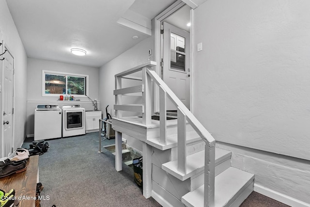 kitchen featuring washer and dryer and dark carpet