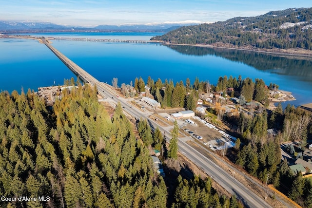 aerial view featuring a water and mountain view