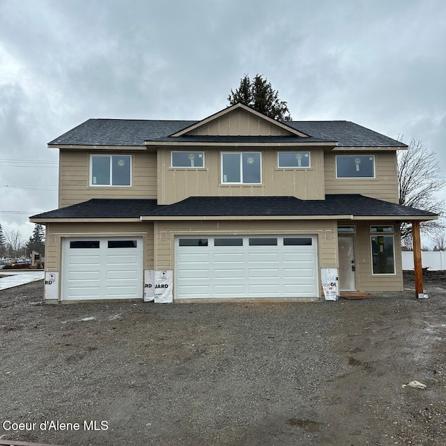 view of front of property with a garage and driveway