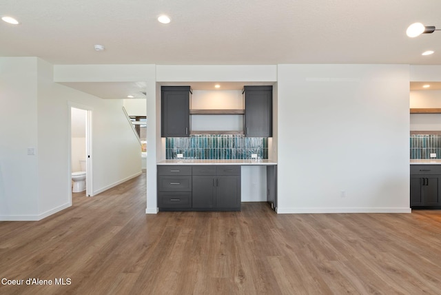 1605 N Garvin Ct, Spokane Valley, WA 99016 - kitchen with open shelves, wood finished floors, gray cabinets, and recessed lighting