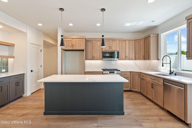 1605 N Garvin Ct, Spokane Valley, WA 99016 - kitchen featuring stainless steel appliances, a sink, recessed lighting, light stone countertops, and decorative backsplash
