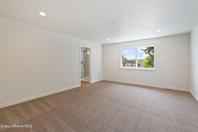 1605 N Garvin Ct, Spokane Valley, WA 99016 - spare room featuring light carpet, baseboards, and recessed lighting