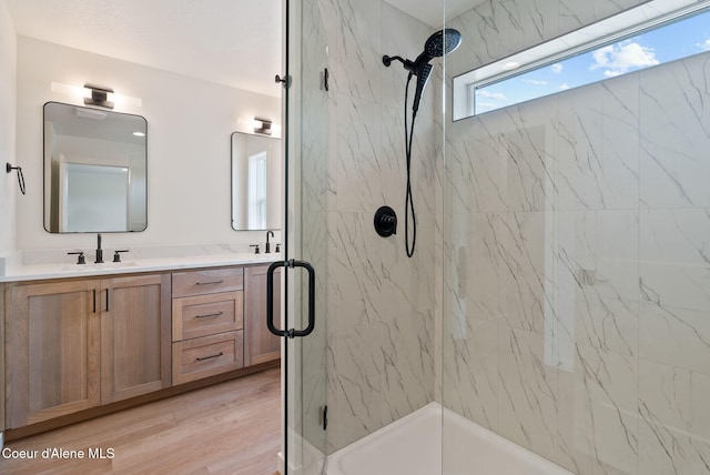1605 N Garvin Ct, Spokane Valley, WA 99016 - bathroom with a marble finish shower, double vanity, and wood finished floors