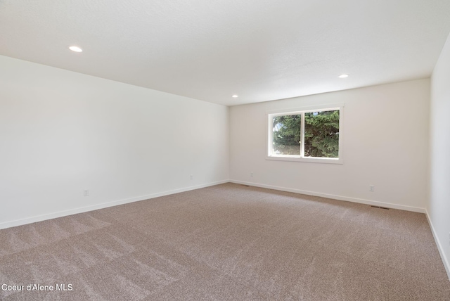 1605 N Garvin Ct, Spokane Valley, WA 99016 - unfurnished room featuring light carpet, recessed lighting, and baseboards