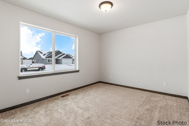 empty room featuring carpet floors