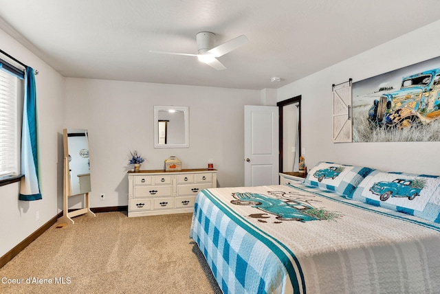 bedroom with light carpet, ceiling fan, and baseboards