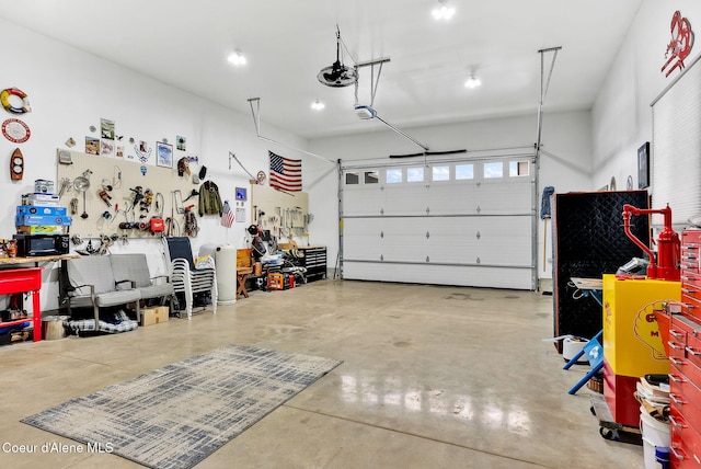 garage featuring a workshop area and a garage door opener