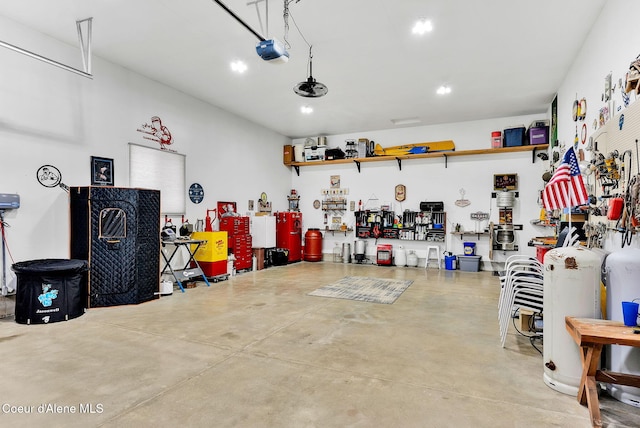 garage featuring a workshop area and a garage door opener